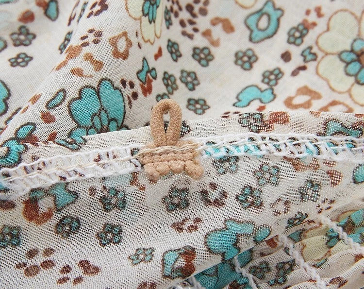 Floral maxi dress with turquoise tassel neckline