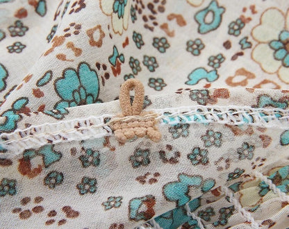 Floral maxi dress with turquoise tassel neckline