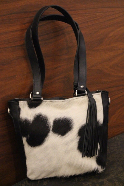 real cowhide purses in black and white