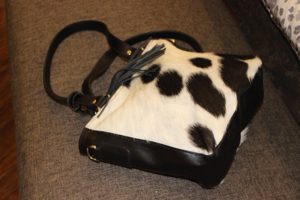 Our cowhide cross body bags are hidden gem, you love the final results. These custom messenger bags are available in western style in brown, black and white