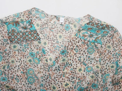 Floral maxi dress with turquoise tassel neckline