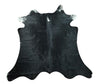 This cowhide rug is an extra small size, perfect for a small space. It is black in color and has a vibrant look that will enhance the appearance of any setting. This rug is also unique, giving your home or office a one-of-a-kind touch.
